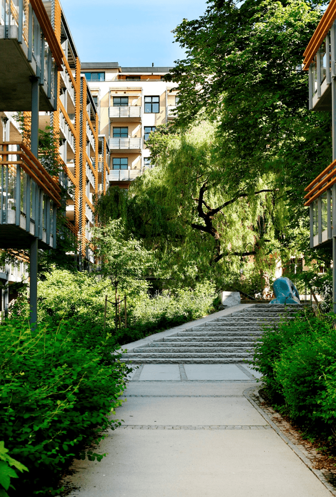 Pilestredet Park a sustainable urban development tale – Oslo. Image shows the pathways of the recycled materials and the landscape design of the urban space between buildings. 